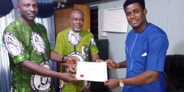 Archbishop Okeke receives KSM 70th Anniversary Award on Archbishop Charles Heerey.